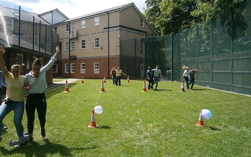 Staff taking part in the three-legged race