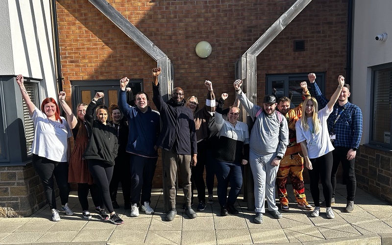 Staff and residents celebrating Dove Valley Mews 'Good' rating